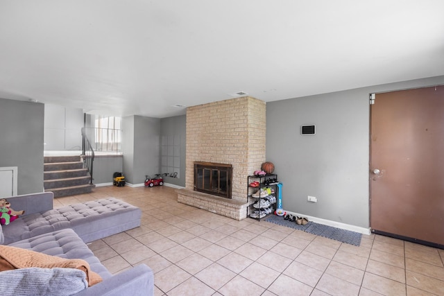 225 S Willow St, Glenwood, IL 60425 - living room with light tile patterned floors, stairs, and a fireplace