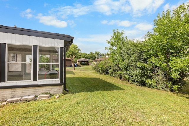 225 S Willow St, Glenwood, IL 60425 - view of green lawn featuring a sunroom