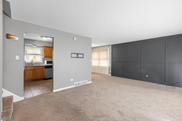 225 S Willow St, Glenwood, IL 60425 - unfurnished living room with light colored carpet and plenty of natural light