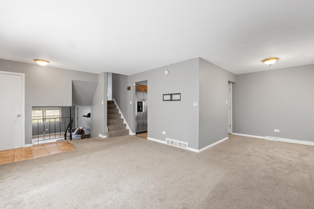 225 S Willow St, Glenwood, IL 60425 - unfurnished living room with carpet flooring and stairs