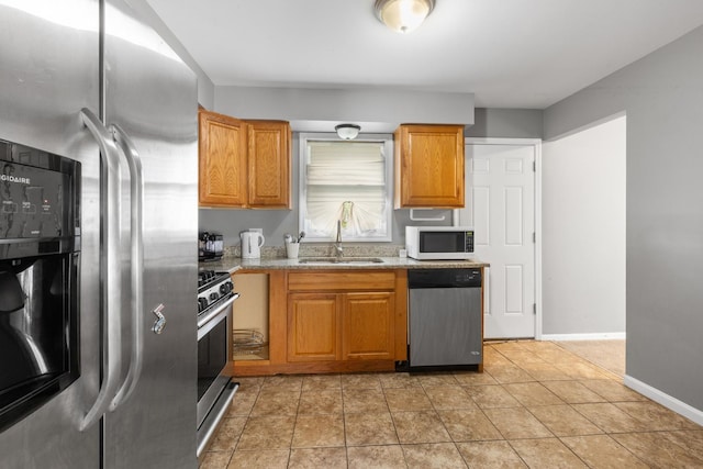 225 S Willow St, Glenwood, IL 60425 - kitchen with stainless steel appliances, light stone counters, and brown cabinets