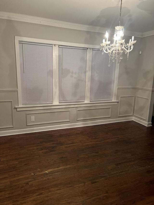 8005 S Blackstone Ave, Chicago, IL 60619 - unfurnished dining area with a decorative wall, a chandelier, crown molding, dark wood-type flooring, and a wainscoted wall