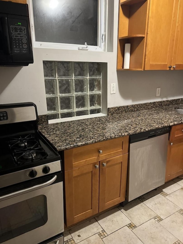8005 S Blackstone Ave, Chicago, IL 60619 - kitchen featuring stainless steel appliances, dark stone counters, brown cabinets, and open shelves