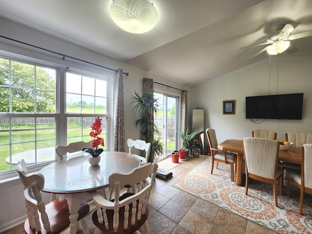 72 Wilton Ln, Mundelein, IL 60060 - dining area featuring stone tile flooring, lofted ceiling, and a ceiling fan