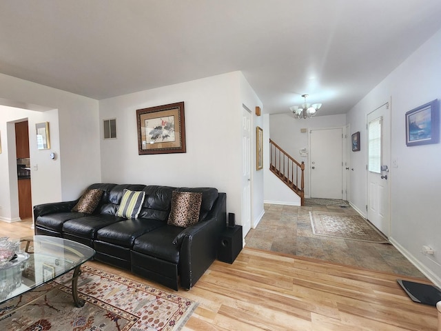 72 Wilton Ln, Mundelein, IL 60060 - living room with a chandelier, light wood-style floors, and stairway
