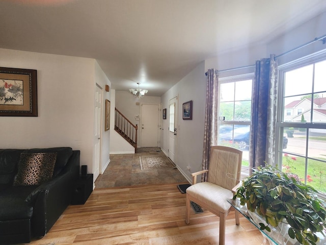 72 Wilton Ln, Mundelein, IL 60060 - entryway featuring light wood-style flooring, stairs, and a chandelier