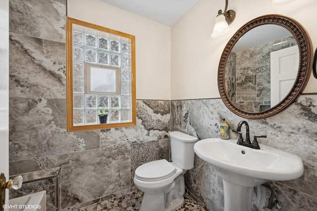 3012 N Nottingham Ave, Chicago, IL 60634 - bathroom featuring tile walls, plenty of natural light, and wainscoting