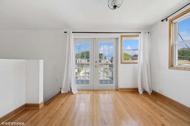 3012 N Nottingham Ave, Chicago, IL 60634 - unfurnished room featuring healthy amount of natural light, french doors, and light wood-type flooring