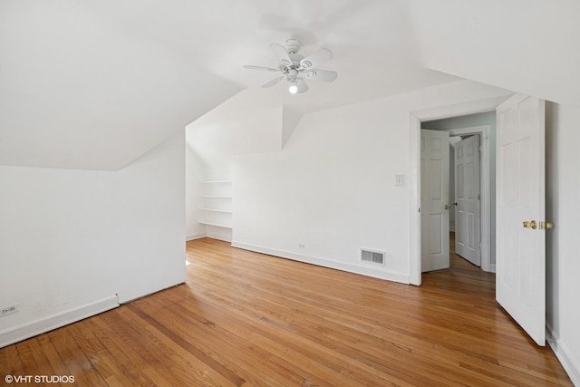 3012 N Nottingham Ave, Chicago, IL 60634 - additional living space featuring a ceiling fan, light wood finished floors, lofted ceiling, and built in shelves