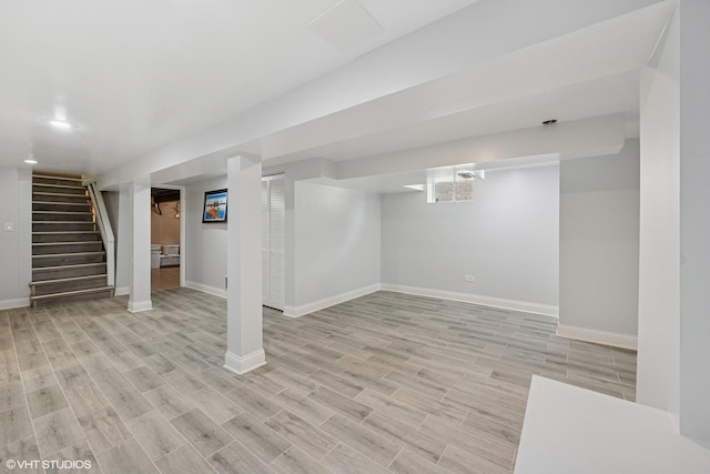 3012 N Nottingham Ave, Chicago, IL 60634 - finished basement featuring light wood-style flooring and stairway