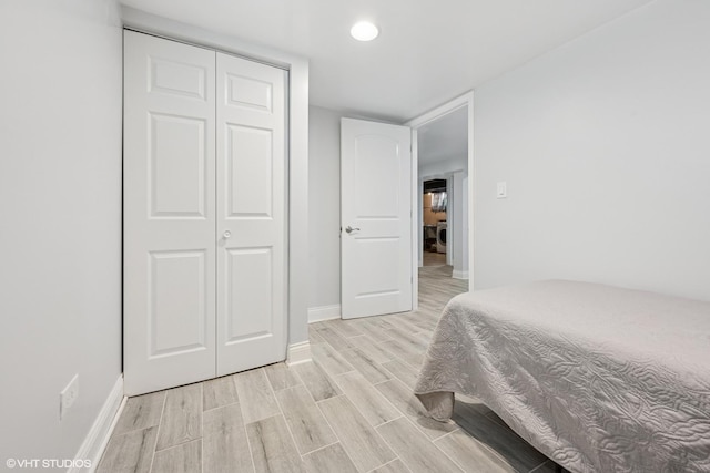 3012 N Nottingham Ave, Chicago, IL 60634 - bedroom with wood tiled floors, a closet, and recessed lighting