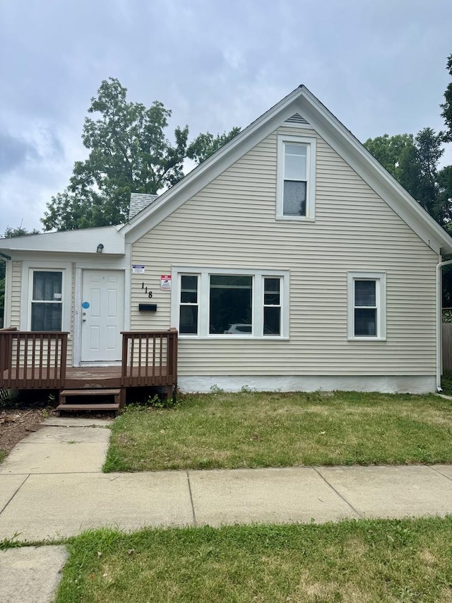 118 Wilcox Ave, Elgin, IL 60123 - view of front of home with a wooden deck and a front lawn