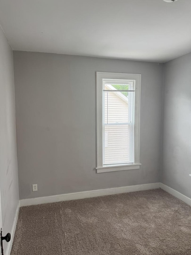 118 Wilcox Ave, Elgin, IL 60123 - carpeted spare room with baseboards