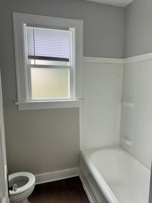 118 Wilcox Ave, Elgin, IL 60123 - bathroom with wood finished floors and a tub