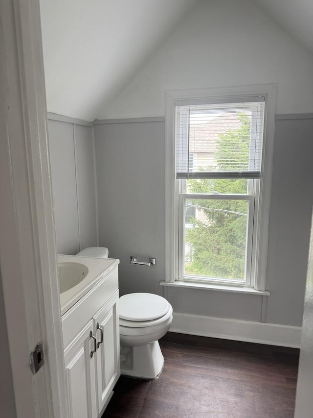 118 Wilcox Ave, Elgin, IL 60123 - half bath featuring lofted ceiling, vanity, and wood finished floors