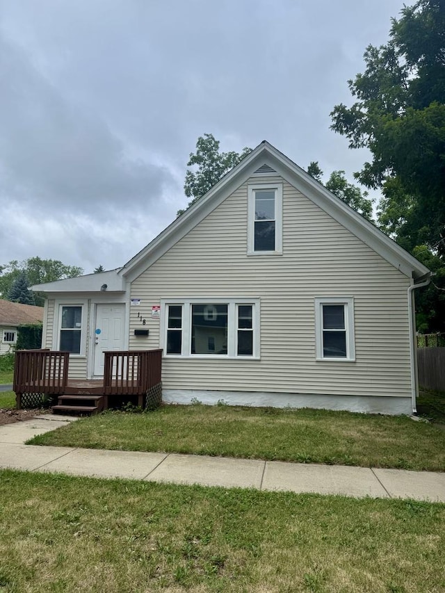 118 Wilcox Ave, Elgin, IL 60123 - back of house featuring a wooden deck and a lawn