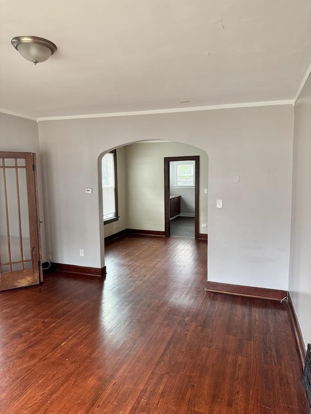 118 Wilcox Ave, Elgin, IL 60123 - unfurnished room featuring arched walkways, ornamental molding, and wood finished floors