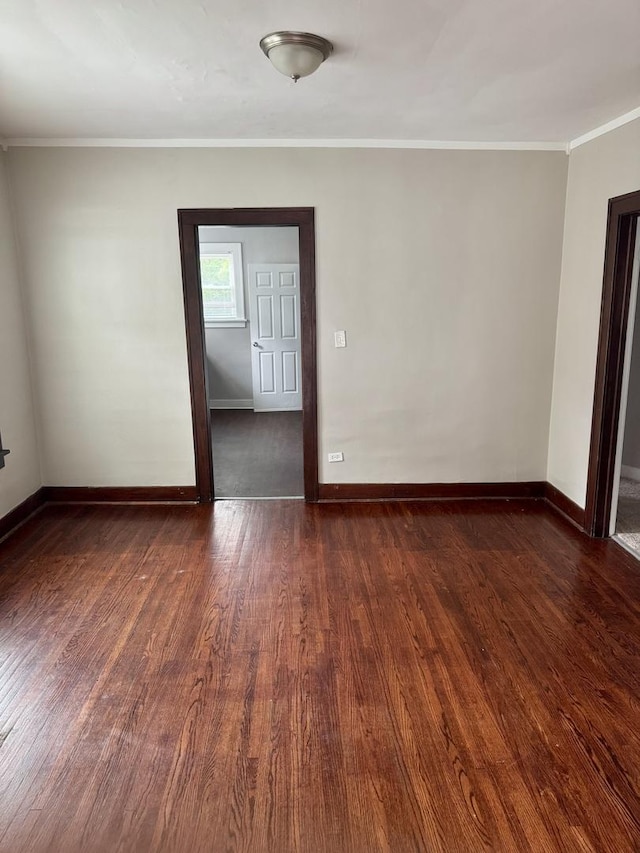 118 Wilcox Ave, Elgin, IL 60123 - spare room featuring dark wood-style flooring and ornamental molding