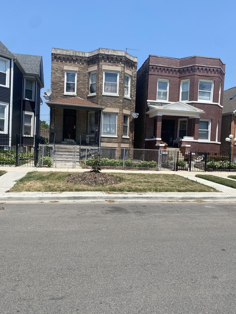 5026 W Fulton St, Chicago, IL 60644 - townhome / multi-family property with a fenced front yard and brick siding