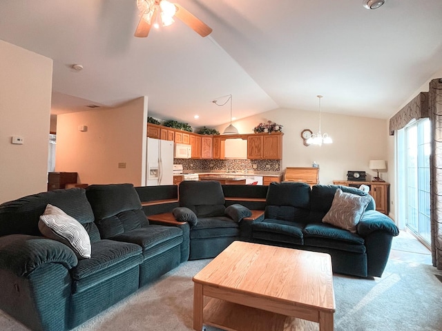 967 Brown Dr, Momence, IL 60954 - living room featuring light carpet, vaulted ceiling, ceiling fan, and a chandelier