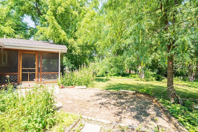14 Grandview Dr, Normal, IL 61761 - view of grassy yard with a patio area and a sunroom
