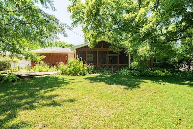 14 Grandview Dr, Normal, IL 61761 - view of green lawn featuring a sunroom