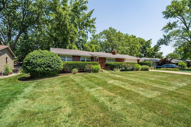 14 Grandview Dr, Normal, IL 61761 - ranch-style house featuring a garage, a front lawn, a chimney, and brick siding
