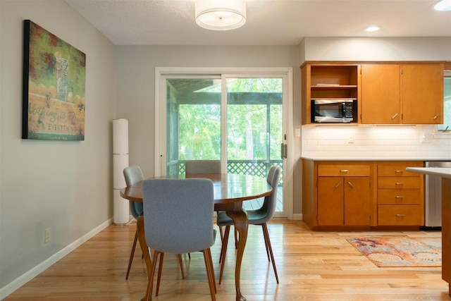 14 Grandview Dr, Normal, IL 61761 - dining area with light wood-style floors and baseboards