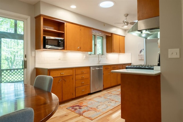 14 Grandview Dr, Normal, IL 61761 - kitchen with stainless steel appliances, wall chimney exhaust hood, tasteful backsplash, light countertops, and recessed lighting