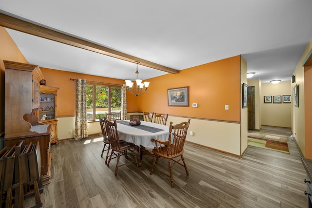 541 Donald St, Hinckley, IL 60520 - dining space featuring wood finished floors, a chandelier, and beamed ceiling