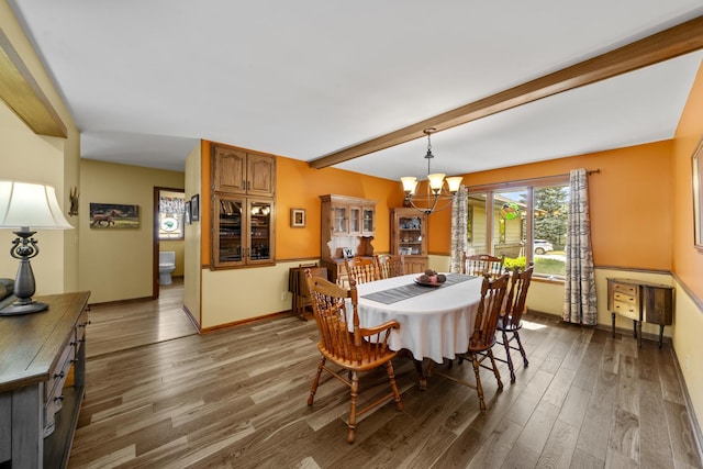 541 Donald St, Hinckley, IL 60520 - dining area featuring beam ceiling, wood finished floors, and a chandelier