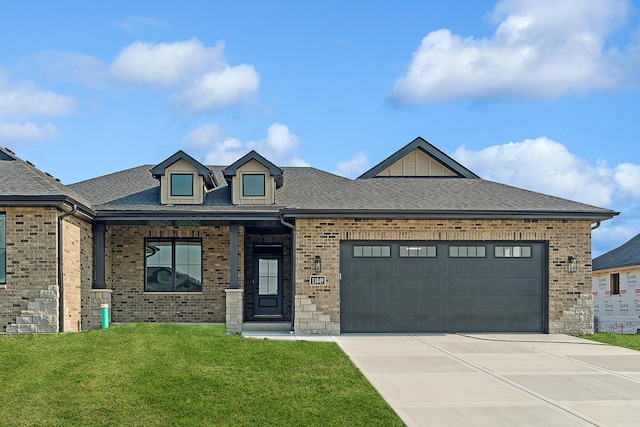 11049 Lizmore Ln Unit 40B, Orland Park, IL 60467 - view of front facade with brick siding, a front lawn, concrete driveway, a garage, and roof with shingles