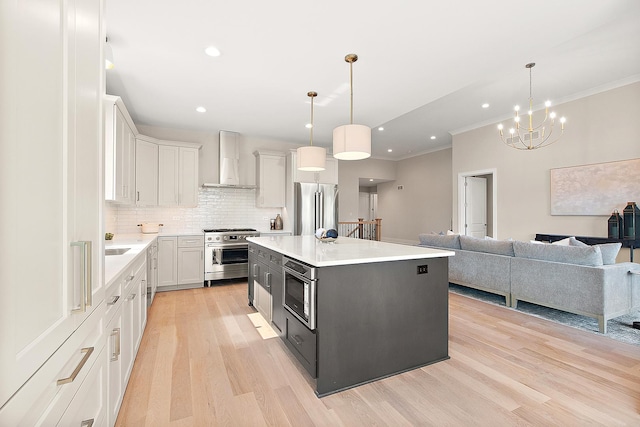 11049 Lizmore Ln Unit 40B, Orland Park, IL 60467 - kitchen with appliances with stainless steel finishes, wall chimney range hood, light wood-type flooring, decorative backsplash, and light countertops