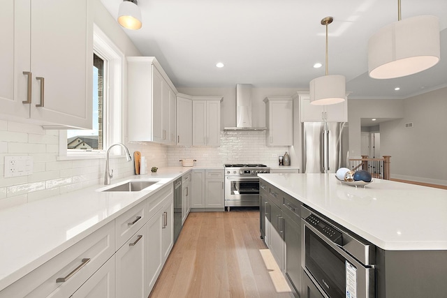 11049 Lizmore Ln Unit 40B, Orland Park, IL 60467 - kitchen featuring stainless steel appliances, wall chimney exhaust hood, backsplash, light wood finished floors, and light countertops