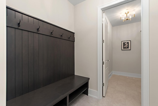 11049 Lizmore Ln Unit 40B, Orland Park, IL 60467 - mudroom featuring a chandelier and light tile patterned floors