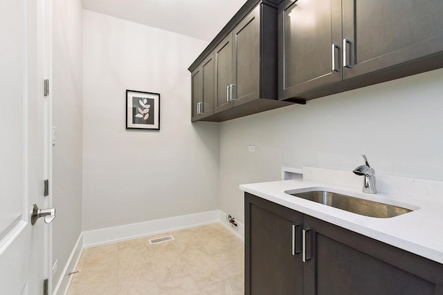 11049 Lizmore Ln Unit 40B, Orland Park, IL 60467 - laundry area featuring washer hookup and cabinet space