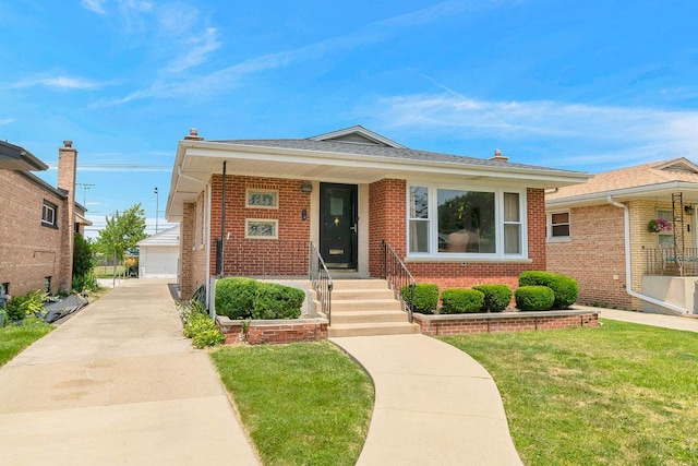 3052 W 100th St, Evergreen Park, IL 60805 - bungalow-style home with brick siding, a front lawn, a detached garage, and an outbuilding