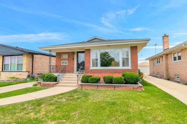 3052 W 100th St, Evergreen Park, IL 60805 - bungalow-style house with a front yard and brick siding