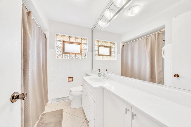 3052 W 100th St, Evergreen Park, IL 60805 - full bath featuring tile patterned flooring, vanity, tile walls, and a wainscoted wall