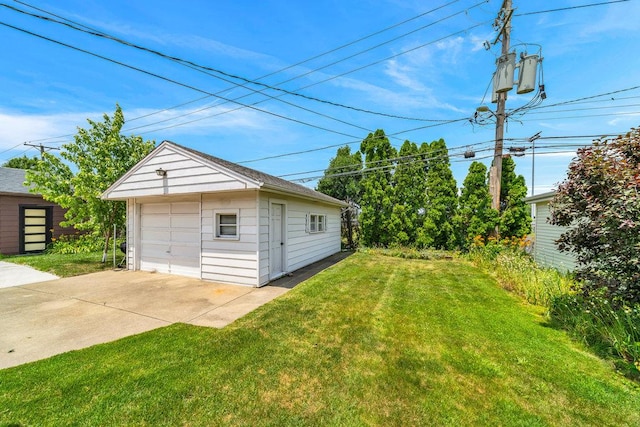 3052 W 100th St, Evergreen Park, IL 60805 - view of green lawn featuring a detached garage, an outbuilding, and concrete driveway