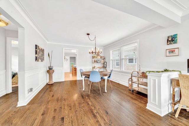 3052 W 100th St, Evergreen Park, IL 60805 - dining area featuring wood finished floors, ornamental molding, a chandelier, and a wainscoted wall