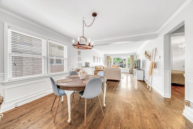 3052 W 100th St, Evergreen Park, IL 60805 - dining area with a chandelier, a decorative wall, crown molding, wainscoting, and light wood-style flooring