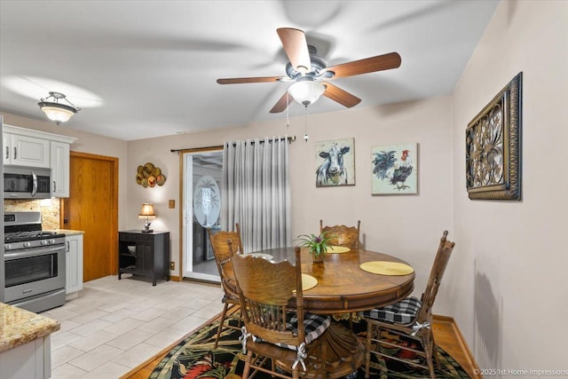 8011 Lawler Ave, Burbank, IL 60459 - dining room with ceiling fan and light tile patterned floors