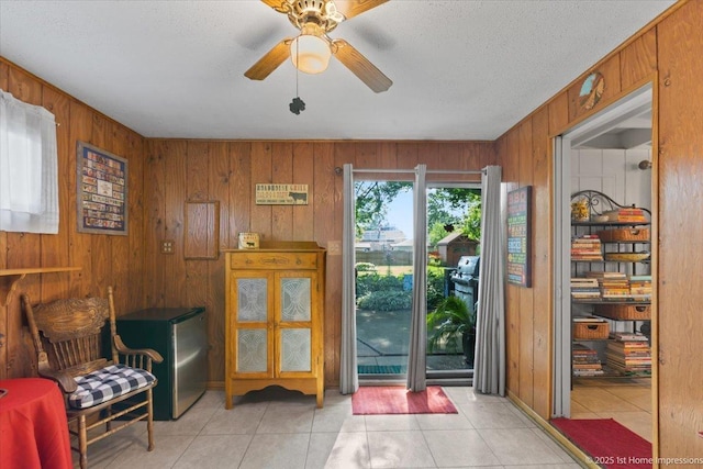 8011 Lawler Ave, Burbank, IL 60459 - foyer entrance with wooden walls, a ceiling fan, and light tile patterned floors
