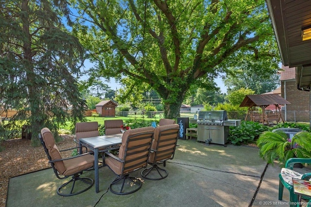 8011 Lawler Ave, Burbank, IL 60459 - fenced backyard featuring a patio, outdoor dining area, a shed, and grilling area