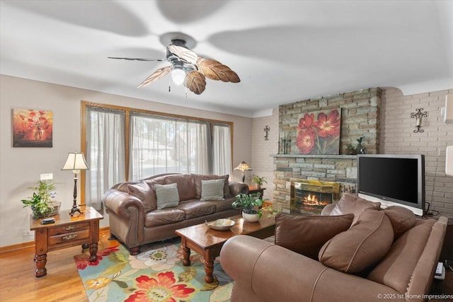 8011 Lawler Ave, Burbank, IL 60459 - living area with a ceiling fan, a stone fireplace, and wood finished floors