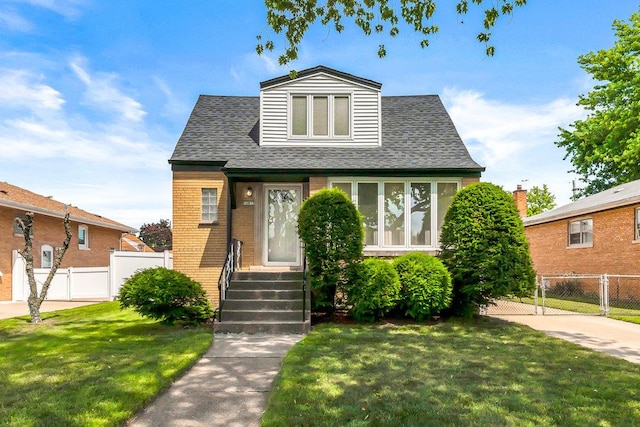 10817 S Kenneth Ave, Oak Lawn, IL 60453 - view of front of property featuring a shingled roof, brick siding, and a gate