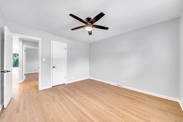 10817 S Kenneth Ave, Oak Lawn, IL 60453 - empty room with a ceiling fan and light wood finished floors
