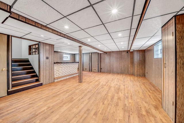 10817 S Kenneth Ave, Oak Lawn, IL 60453 - below grade area with light wood-type flooring, wood walls, and stairway