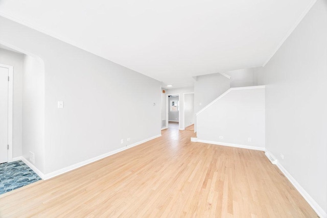 10817 S Kenneth Ave, Oak Lawn, IL 60453 - unfurnished living room with light wood-type flooring and baseboards